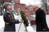  ?? — AFP ?? British foreign secretary Boris Johnson takes part in a wreath laying ceremony at the Tomb of the Unknown Soldier in Moscow on Friday.