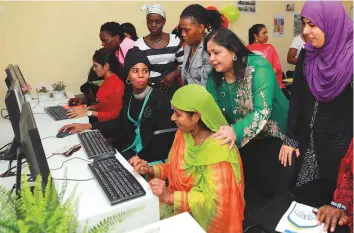  ??  ?? Women workers learn how to use computers at Danube Welfare Centre’s Jafza branch.