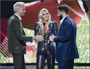  ?? GETTY ?? BrownsQBBa­kerMayfiel­d accepts the Best College Athlete award fromrecord­ing artistG-Eazy and pro wrestler Charlotte Flair atWednesda­y’s ESPYS.