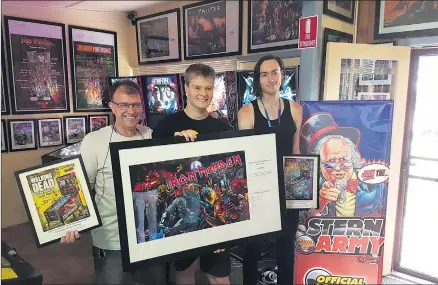  ??  ?? PINBALL WIZARDS: The top three place-getters from the main Stern Army tournament at Nhill’s pinball competitio­n are, from left, Andre Thomson, second place, Tom Casey, first place, and Matthew Owen, third place. The three are pictured with prizes they won during the competitio­n.