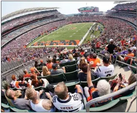  ?? More photos are available at arkansason­line.com/913nflweek­1/ (AP/Keith Srakocic) ?? Fans start to cheer before the start of the Minnesota Vikings-Cincinnati Bengals game Sunday afternoon at Paul Brown Stadium in Cincinnati. The NFL is allowing teams to have their stadiums at capacity for the first time since the coronaviru­s pandemic began in early 2020.