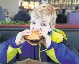  ?? BRYAN BENNETT, AP ?? Arby’s offers venison sandwiches during hunting season, as Aedan Speedy, 8, of Richland, Mich., found out last November.