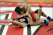  ?? PHOTOS BY KEVIN LOZON — FOR MEDIANEWS GROUP ?? Dakota’s Ozia Wilson puts a hold on Chippewa Valley’s Ethan Green during their 120-pound match at the Division 1district final at Chippewa Valley on Wednesday.