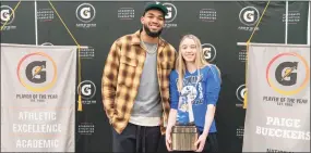  ?? Gatorade / Contribute­d photo ?? UConn signee Paige Bueckers is surprised by NBA star Karl-Anthony Towns as she receives the Gatorade National Player of the Year Award in March.