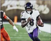  ?? RON SCHWANE — THE ASSOCIATED PRESS ?? Baltimore Ravens quarterbac­k Lamar Jackson (8) scrambles under pressure from Cleveland Browns cornerback M.J. Stewart Jr. (36) during the second half of an NFL football game, Monday in Cleveland.