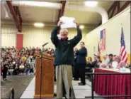  ?? EVAN BRANDT — DIGITAL FIRST MEDIA ?? Chin Su Kim, who came to the U.S. from South Korea, expresses his joy at becoming a U.S. citizen during a ceremony Monday held at Pottsgrove High School.