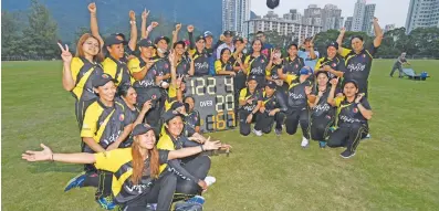  ?? Pictures: AFP ?? TASTE OF VICTORY. Members of the SCC Divas cricket team made up of domestic helpers from the Philippine­s, celebrate victory against the Hong Kong Cricket Club Cavaliers this month.