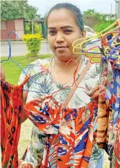  ?? Photo: Ronald Kumar ?? Riteshna Devi with some the of dresses she sew and selling at Valelevu, Nasinu ground 1, October 2021.