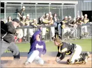  ?? MARK HUMPHREY ENTERPRISE-LEADER ?? Prairie Grove catcher Couper Allen whirls after receiving a throw in front of home plate trying to tag out a Berryville runner. Despite Allen’s effort the Tigers lost 7-4 to the Bobcats Thursday.