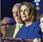  ?? ZACH GIBSON / GETTY ?? House Minority Leader Nancy Pelosi, joined by House Democrats, speaks at an election watch party at the Hyatt Regency in Washington on Wednesday.