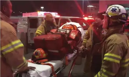  ??  ?? Emergency medical staff at New York’s John F Kennedy internatio­nal airport. Photograph: AP