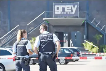  ??  ?? Police stand in front of the disco club Grey in Konstanz. — AFP photo