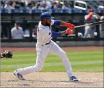  ?? JULIE JACOBSON - THE ASSOCIATED PRESS ?? New York Mets’ Austin Jackson connects for an RBI double against the Cincinnati Reds during the eighth inning of a baseball game, Wednesday, Aug. 8, 2018, in New York. Brandon Nimmo scored on the play. The Mets won 8-0.