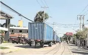 ?? Handout ?? Trucks routinely travel between Haiti and the Dominican Republic as part of the country’s vibrant trading relations. However, migration remains a thorny issue between the neighborin­g countries.