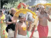  ??  ?? A young devotee carries his kavady at the Shri Siva Subramania­r Alyam in Umdloti Drift, Verulam.