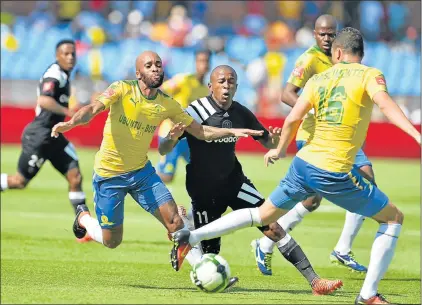  ?? Picture: GALLO IMAGES ?? GOING FOR BROKE: Orlando Pirates’ Luvuyo Memela, centre, and Oupa Manyisa, left of Mamelodi Sundowns fight for the ball during their league match at Loftus Versfeld Stadium on Saturday. Pirates coach Milutin Sredojevic won’t entertain any title hopes...