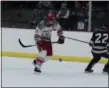  ?? MICHAEL P. PAYNE — FOR THE NEWS-HERALD ?? Mentor’s Jack Heller vies for a puck during a 7-7 tie with Rocky River at Mentor Civic Arena.