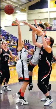  ??  ?? Gravette’s Stephanie Pinter and Berenice Garcia block a Pea Ridge shot during play between the two teams in Berryville on Saturday.