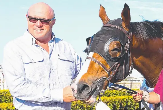 ?? Picture: AAP IMAGE ?? Trainer Liam Birchley with stable star Crack Me Up after the horse won the Recognitio­n Stakes at Doomben in November.