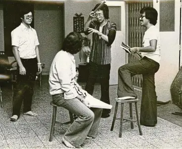  ??  ?? Chin San Sooi ( centre, holding the stick), a drama product of ipoh ACS, rehearsing a production with his cast in the late 1970s. — photos: Filepics