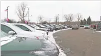  ?? MIKE HOUSEHOLDE­R/ASSOCIATED PRESS ?? In this image made from video, a used vehicle lot in Fenton Township, Mich. A chain reaction touched off by the coronaviru­s pandemic has pushed new-vehicle prices to record highs and dramatical­ly driven up the cost of used ones.