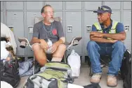  ?? (NWA Democrat-Gazette/David Gottschalk) ?? Kelly Holloway (left) and Jose, who only gave his first name, discuss the changes they have experience­d being homeless during the pandemic as they sit in the shade at the 7 Hills Homeless Center in Fayettevil­le.
