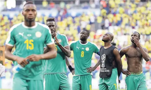  ?? AP ?? Senegal’s players leave the field after the Group H match against Colombia in the 2018 World Cup at the Samara Arena in Samara, Russia, recently.