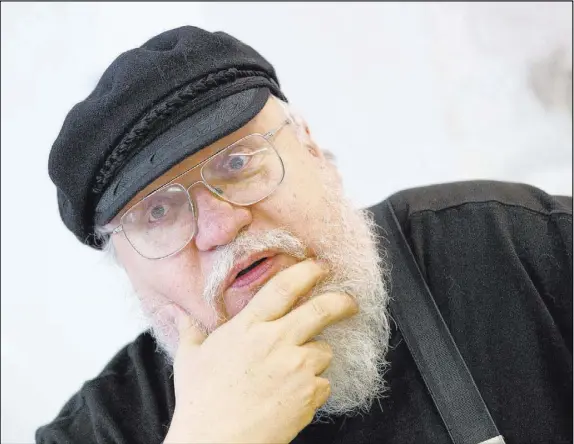  ?? Christian Charisius The Associated Press ?? There’s a glimmer of hope that George R.R. Martin has at long last completed the final two books in his “Song of Fire and Ice” series.