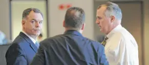  ?? SUN-TIMES FILE ?? Then-Police Supt. Garry McCarthy (left) with detectives before a 2012 press conference announcing arrests in the murder of CPD Officer Clifton Lewis.