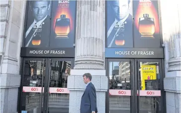  ??  ?? A man walks past a House of Fraser store in Monument, London on August 2, 2018.