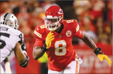  ?? Associated Press ?? Playoff success: Kansas City Chiefs defensive end Carlos Dunlap rushes against Las Vegas Raiders fullback Jakob Johnson (45) during the first half of an NFL football game, Monday, Oct. 10, 2022 in Kansas City, Mo. Dunlap signed with the Chiefs because he was tired of losing: six times in the playoffs without a win. Now, he might bookend his first playoff victory with one in the Super Bowl.