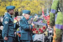  ?? CHRISTOPHE­R KATSAROV THE CANADIAN PRESS ?? Honorary Lt.-Gen. Richard Rohmer places a wreath during the Ceremony of Remembranc­e held Sunday at Queen’s Park in Toronto.