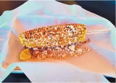  ?? RICHARD S. DARGAN/FOR THE JOURNAL ?? Elote is served with lime aioli, Cotija cheese and a dusting of chile powder.