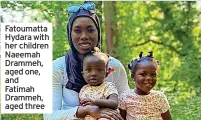  ?? ?? Fatoumatta Hydara with her children Naeemah Drammeh, aged one, and Fatimah Drammeh, aged three