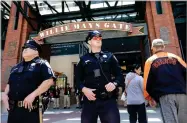  ?? AP PHOTO BY JEFF CHIU ?? In this May 13, photo, San Francisco Police officers Joe Juarez, left, and Chris Simpson wear body cameras while patrolling outside of AT&T Park before a baseball game between the San Francisco Giants and the Cincinnati Reds in San Francisco.