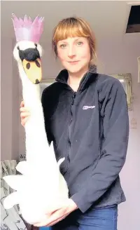  ??  ?? Natalie’s daughter Amy and the faux taxidermy swan she made for her