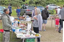  ?? 01_B32loch12 ?? Bric-a-brac aplenty as visitors browse the goods and books on sale.