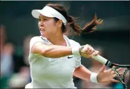  ?? AP FILE ?? Li Na plays a return during her last Wimbledon match in 2014. Li is returning to the All England Club this year where she will partner with Japan’s Ai Sugiyama in the invitation­al doubles.