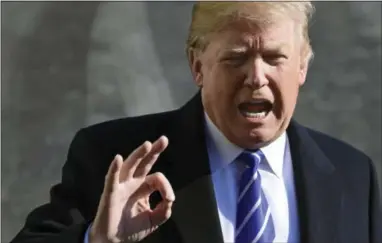  ?? THE ASSOCIATED PRESS ?? President Donald Trump talks with reporters as he departs from the South Lawn of the White House via Marine One in Washington on Saturday to spend the weekend at Camp David in Maryland.