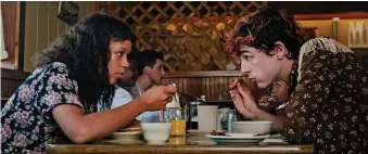  ?? ?? Tucking in: Taylor Russell and Timothee Chalamet have a taste for human flesh