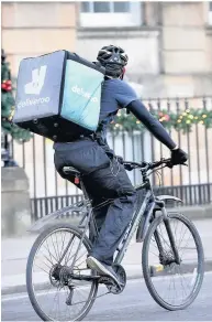  ??  ?? Deliveroo bicycle couriers can be seen on the roads around Loughborou­gh.