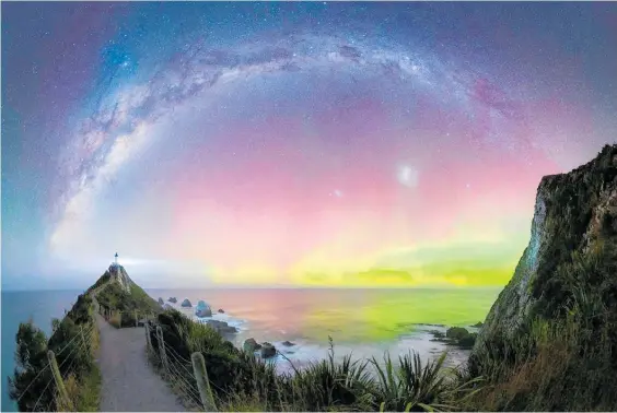  ?? Photo / Douglas Thorne ?? Douglas Thorne photograph­ed the aurora which emerged to the right of the Nugget Point lighthouse.