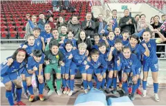  ??  ?? PARTY TIME: Thai players pose with Leicester owner Vichai Srivaddhan­aprabha, centre back row, after their victory over the Philippine­s on Thursday.