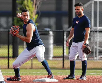 ?? Karen Warren / Houston Chronicle ?? Carlos Correa, left, and Jose Altuve have been early-morning fixtures at the Astros’ spring complex at West Palm Beach, Fla. “If we can get a guy by half a step,” Correa says of turning double plays, “it’s really important to get those two outs.”