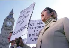  ?? — Reuters file photo ?? A demonstrat­or demanding her return to the Chagos Islands in the Diego Garcia archipelag­o shouts during a protest outside the Houses of Parliament in London.