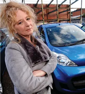  ??  ?? Waiting: Gill Walker and her Peugeot 107, which was damaged