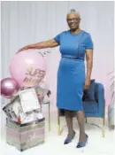  ??  ?? Jacinth Kelly, assistant vice-president, insurance accounting, corporate accounts, Sagicor Life Jamaica, is happy with her Mother’s Day gift.