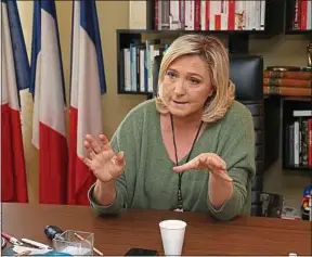  ??  ?? Marine Le Pen nous a reçus dans son bureau à Nanterre, jeudi.
