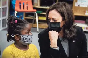  ?? Drew Angerer / Getty Images ?? Vice President Kamala Harris chats with Galya Nkwenti, 5, during a visit to the West Haven Child Developmen­t Center on Friday.