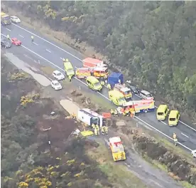  ?? Photo / Westpac Rescue Helicopter ?? Police believe the tour bus veered on to the wrong side of the road before it over-corrected and rolled.